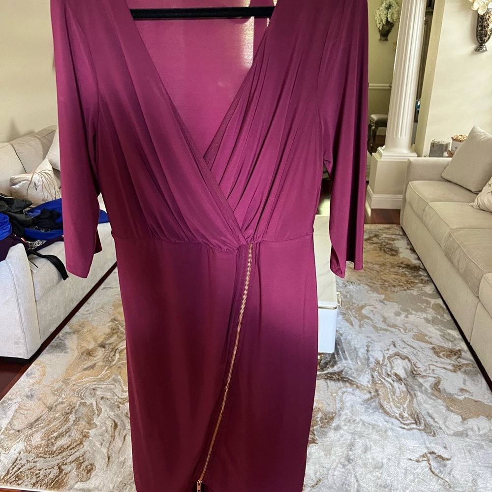 Burgundy dress with zipper that opens near knee